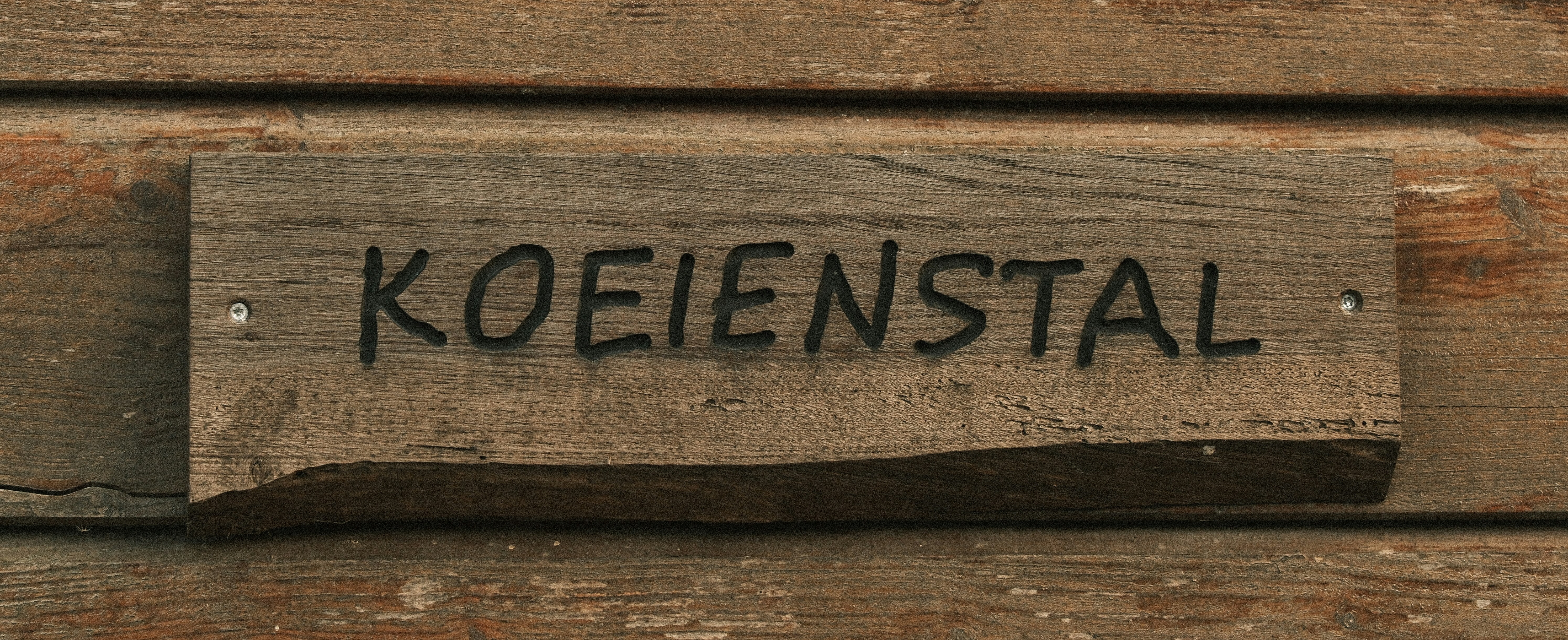 Cowshed.. shed not shit.. Koeienstal in Dutch means something like a Big Mess.. for more info visit the website https://www.stadsboerderijalmere.nl/